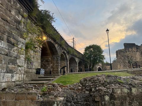 Stone railway arches at dusk