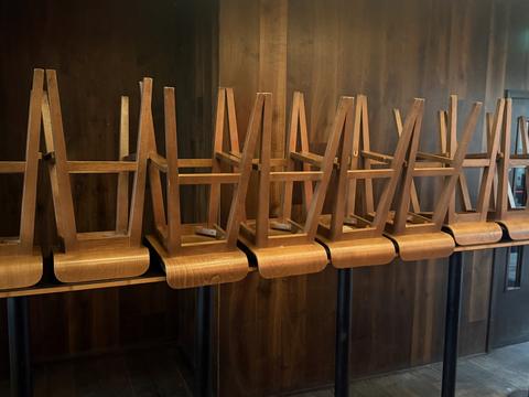 Bar stools stacked on a timber counter