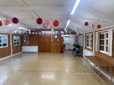 Community hall with bunting and paper lanterns